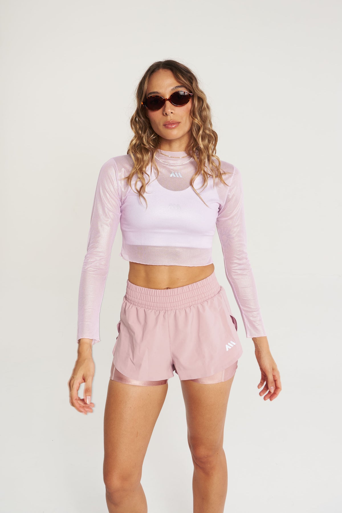 PERFORMANCE LONG SLEEVE CROP TOP GLOW